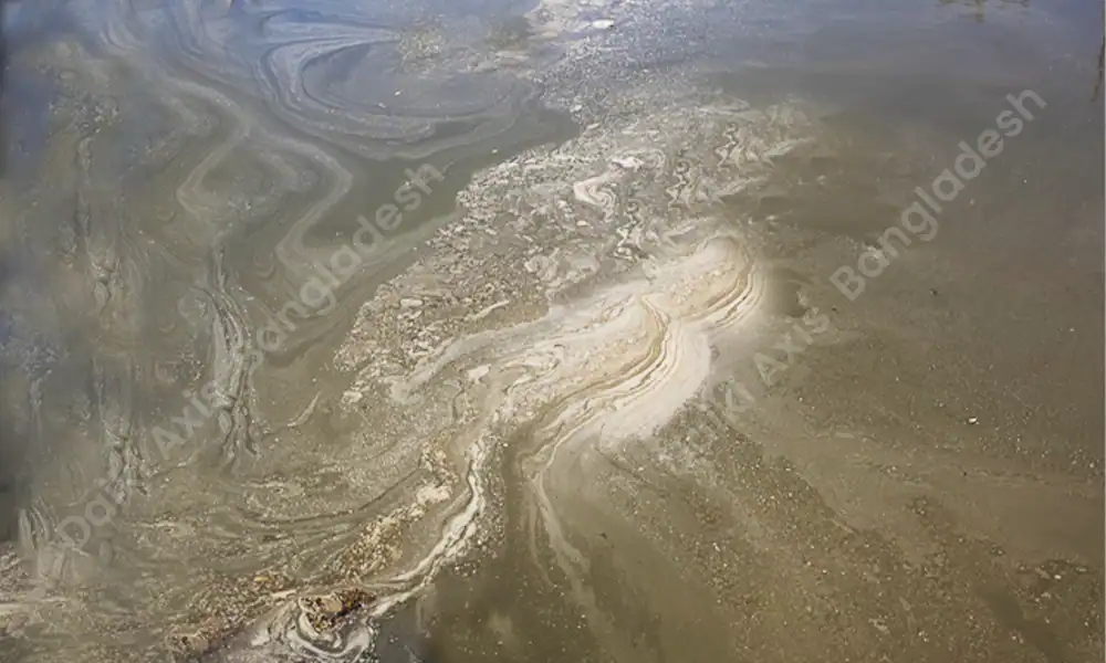 Swirling oil spill in water with visible pollution, environmental contamination, and pollution control issues.