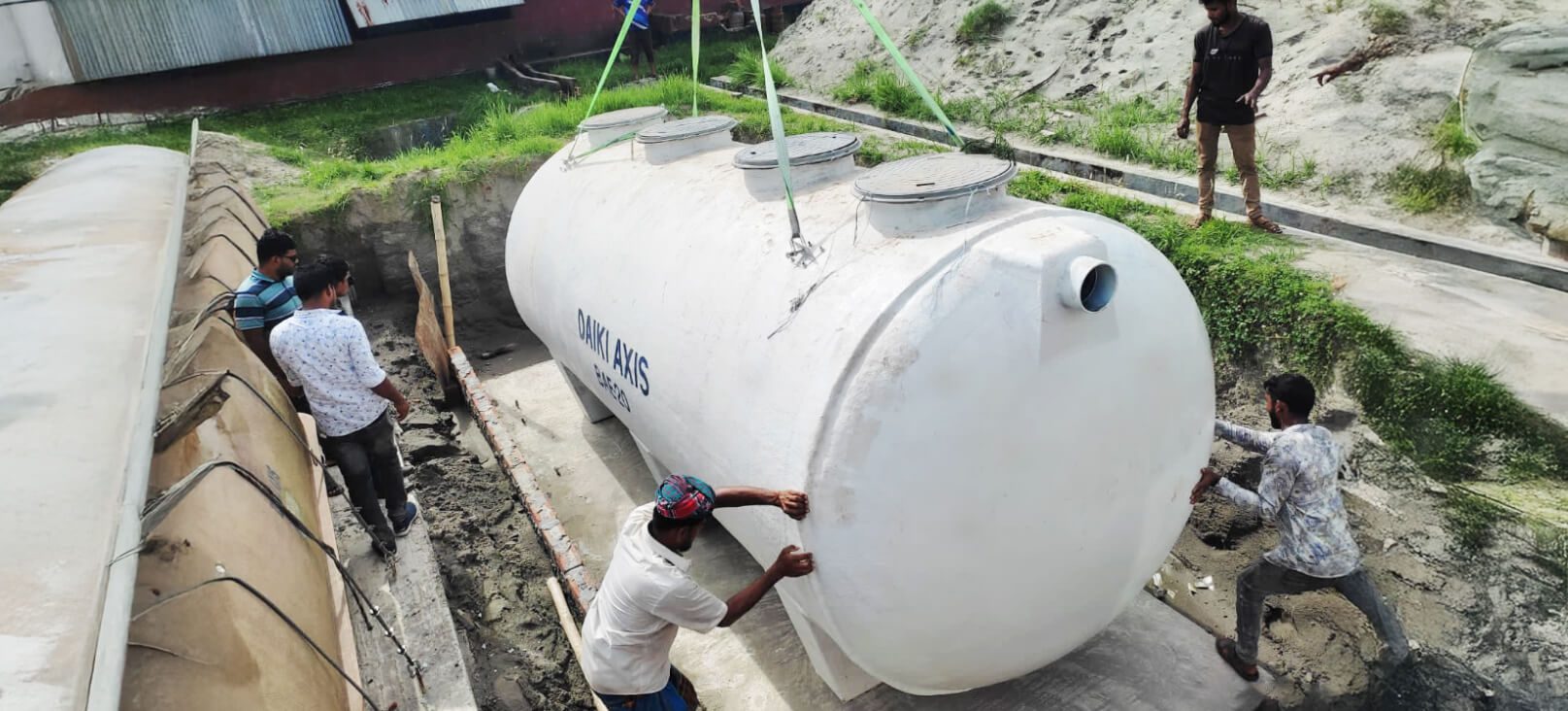 Daiki Axis Bangladesh team installing a wastewater treatment plant FRP tank at a client site.